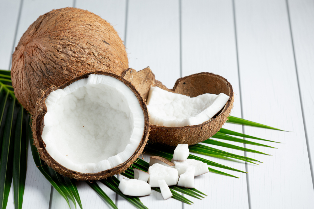 fresh coconuts put white wooden background